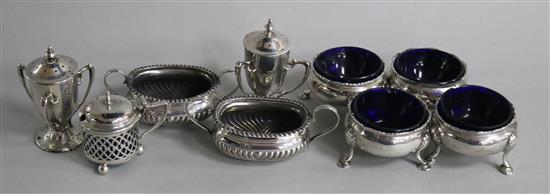 Four George III silver cauldron salts and five other silver condiments.